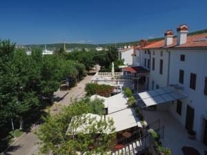an overhead view of a street with buildings and trees at Apartman Seven Waves in Punat