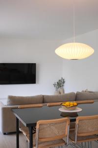 a living room with a table and a couch at Apartment Maestral, Pucisca ,Island Brac in Pučišća