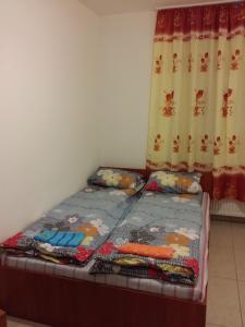A bed or beds in a room at M+D Hotel