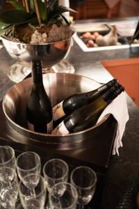 a bottle of wine in a metal container with glasses at Hotel Ritter Badenweiler in Badenweiler +58 photos