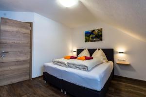 Postel nebo postele na pokoji v ubytování Haus Sandeck