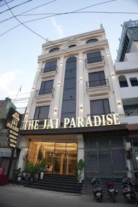 a building with a sign that reads the jazz parakeet at Thejaiparadise by jai hotel in Rohtak