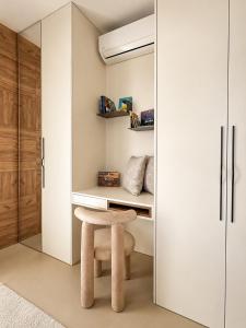 a room with a desk and a stool at Eurovea Tower, 27th floor apartment, free parking in Bratislava +23 photos
