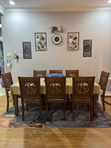 a dining room with a table and chairs at SYA Homestay Bachok in Bachok +8 photos