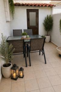 a patio with a table and chairs and lights at Villa Harmonia I -Elegant Retreat in Karlovasi