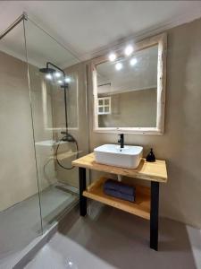 a bathroom with a sink and a shower at Stone & Sea Retreat in Órmos Marathokámpou +13 photos