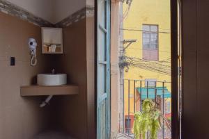 a bathroom with a sink and a window at Doña Vicenta Casa Colonial in Guanajuato +225 photos