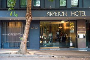 a k kitchen hotel on a city street with a tree at Kirketon Hotel Sydney in Sydney