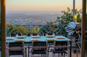 a table and chairs on a balcony with a view at Villa Vista in Valados