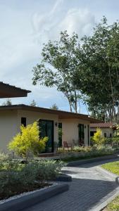 a house with a porch and a patio at ภัสรา รีสอร์ท in Ban Nong Khla