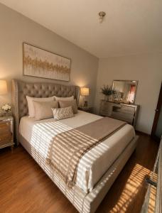 a bedroom with a large bed and a mirror at Oceanview house in El Suazal +27 photos