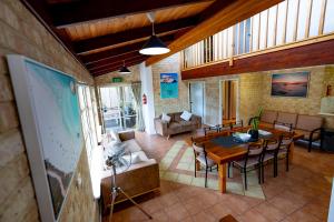 a large living room with a table and chairs at Esperance Foreshore Apartments in Esperance