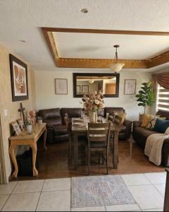 a living room with a table and a couch at Oceanview house in El Suazal