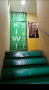 a stairway with green steps in a building at kiwi budget hotel in Rawang