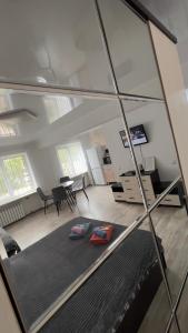 a view of a living room with a mirror at Однокомнатная квартира в центре города in Balqash