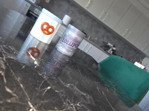 a counter top with two containers of food on it at Marcus Residence Apartment in Satu Mare +34 photos