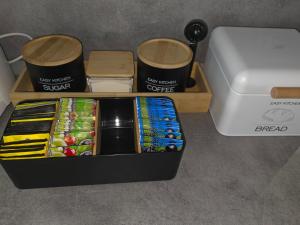 a black box filled with different types of food at Marcus Residence Apartment in Satu Mare