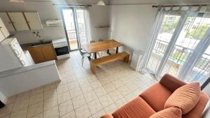 a living room with a couch and a table at Amalthia Hotel Apartments in Rethymno