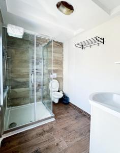 a bathroom with a shower and a toilet at Arz'Urla Restaurant & Otel in Urla +20 photos