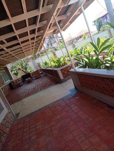 an empty patio with plants in a building at Spring homes2 in Jinja
