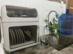 a toaster oven sitting on top of a counter at Sapayag Backpacker's Inn in Dipolog