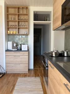 a kitchen with a counter with pots and pans at Aia Home in Kuressaare