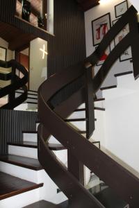 a set of stairs in a room with black and white at Dorfchalet in Goldegg