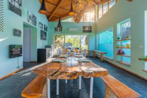 a large room with a large wooden table in it at Seclude Ramgarh Cliff's edge in Rāmgarh