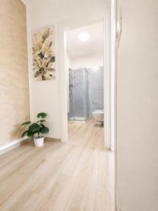 a hallway with a bathroom with a toilet and a sink at A due passi dal mare in Giulianova