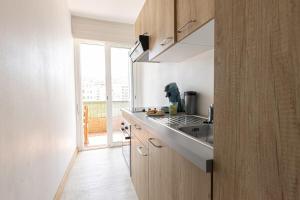 a kitchen with a sink and a counter top at "U Valincu" – Studio Centre Plage | by Efficios in Propriano +3 photos