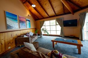 a living room with two couches and a coffee table at Esperance Foreshore Apartments in Esperance