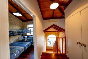 a hallway with bunk beds in a house at Esperance Foreshore Apartments in Esperance