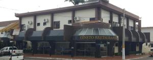 a building with a sign that reads yucaipa restaurant at Veneza Plaza Hotel in Gurupi