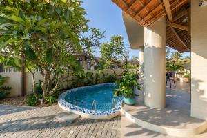 a swimming pool in the middle of a patio at Ban Mai Village in Phú Hiệp