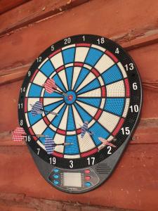 a dart board is attached to a wall at Sunčana Strana Fruške Gore in Sremski Karlovci