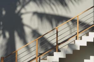 a set of stairs with a metal railing at The Seascape in Matara