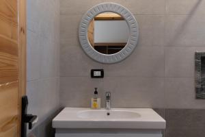 a bathroom with a sink and a mirror at Amun Dahab Hotel in Dahab +20 photos