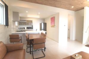 a kitchen and living room with a table and chairs at at60% - Vacation STAY 53162v in Nishibaru