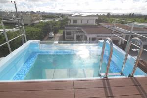 a pool on the roof of a house at at60% - Vacation STAY 53162v in Nishibaru