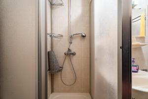 a shower in a bathroom with a shower at Appartement Bergluft in Sasbachwalden +21 photos