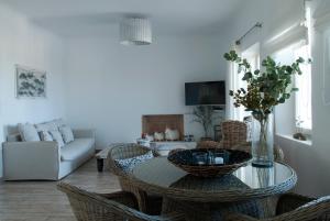 a living room with a table and chairs at Chrysalis Nature Villa 3 in Kampos Paros