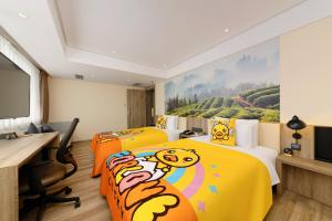 two beds with hello kitty beds in a room at Atour Hotel Chongqing Jiefangbei in Chongqing