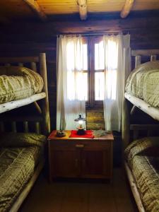 Una cama o camas en una habitación de Cabañas Sehuen