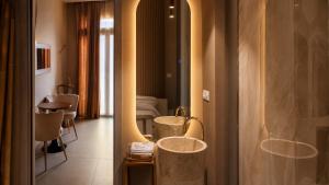 a hotel room with two sinks in a room at charme suite delux in Terrasini +28 photos