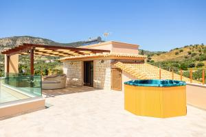 a villa with a view of a house at Vamavi Maison - Villa with Private Pool, Salamina in Salamina