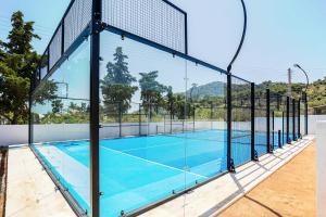 a tennis court with a net on top of it at Vamavi Maison - Villa with Private Pool, Salamina in Salamina