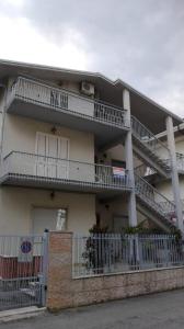 a building with balconies on the side of it at La casa di Rosy in Alba Adriatica