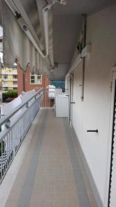 an empty balcony of a building with white walls at La casa di Rosy in Alba Adriatica +2 photos