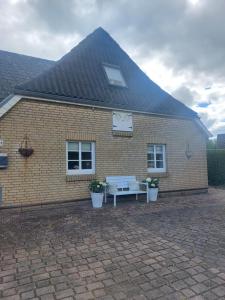 a brick building with a clock on top of it at Appartement Dorfstrasse in Glücksburg