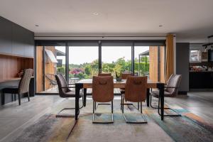 a dining room with a table and some chairs at La Chambre Loft in Hennebont